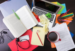 Girl working at the chaotic workplace